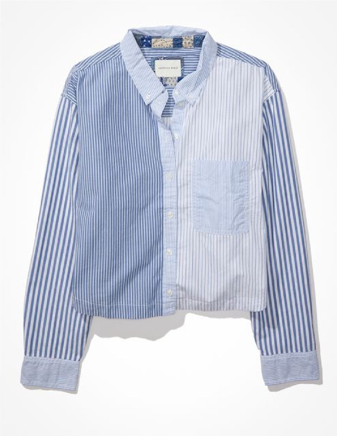 قميص باللون الابيض والازرق