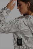 Long-sleeved cropped jacket with a small logo on the chest